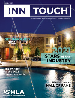 InnTouch Holiday 2021 cover image. Outdoor courtyard with pool at night image.