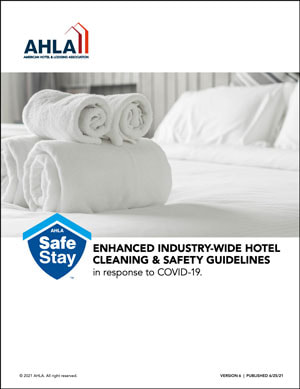 Cover image of AHLA's Safe Stay Guide. Mainly white cover with AHLA logo, safe stay logo, title (Enhanced Industry-wide Hotel Cleaning & Safety Guidelines in response to COVID-19.
