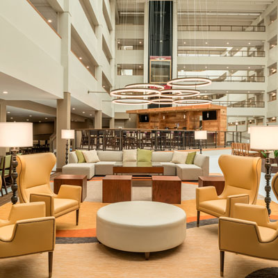 Photo of hotel lobby with lots of seating. Open concept.