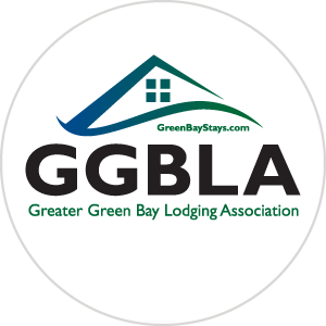 Greater Green Bay Lodging Association logo. Blue to green gradient roof and wavy swoop over top of GGBLA initials.