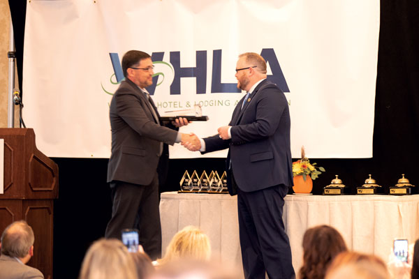 Board Chair, Brandon McConnell being recognized for his contributions to WHLA at the 2022 Wisconsin Lodging Conference